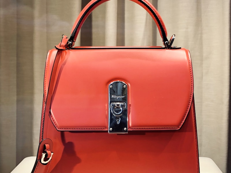Wiping a leather bag with a soft cloth